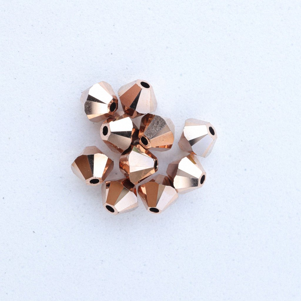 SW_00017 Swarovski® Perle Doppelkegel Bicon 5328 Xilion Beads 4mm crystal rose gold 2xAB