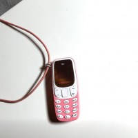 11926 Lederband mit kleinstem Handy der Welt, Telefonie, SMS, Musik, mit Anhängerschlaufe